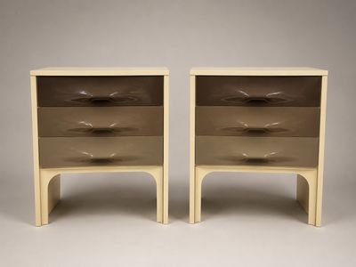 a pair of nightstands with two drawers on each side