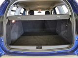 the back of a car with the trunk open and the seats down
