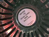a close up of a metal bowl with a label on it