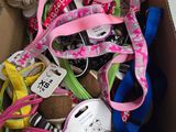 a cardboard box filled with various types of bows and ribbons