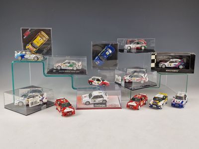 many different models of cars in a display case