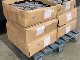 several boxes of tools are stacked on a pallet in a warehouse