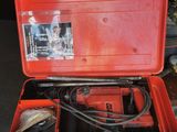 a tool box with a tool in it sitting on the floor
