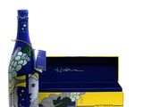 a bottle that is sitting next to a box