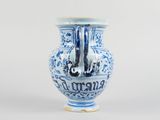a blue and white vase sitting on a table