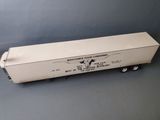 an image of a toy truck with a white trailer on a gray surface