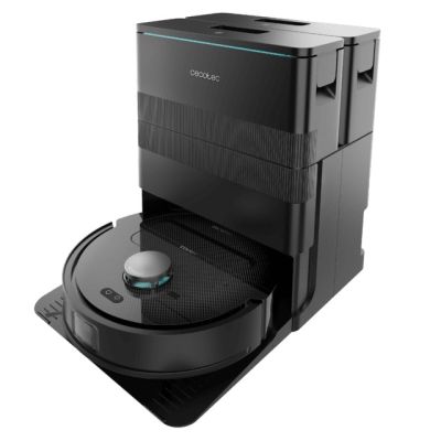 the robot vacuum is on top of a black box