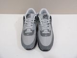 the nike air max is a grey and white shoe with a black sole