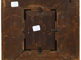 a close up of a wooden frame with a tag on it