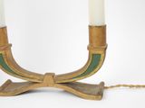 pair of brass candles with green and white candlesticks on a chain