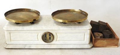 two bowls sitting on top of a white box