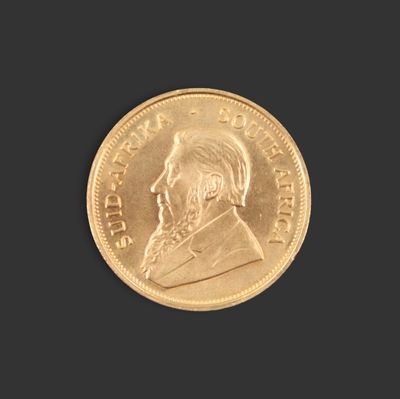 une image d'une pièce d'or sur fond noir