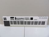 a close up of a keyboard on a table with a white background