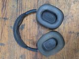 a pair of headphones sitting on a wooden table