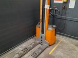 a fork lift truck parked in a garage