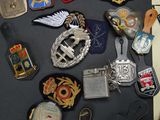 many different types of military badges on a table