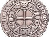 Gros plan sur une pièce d'argent portant une croix