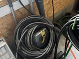 a lot of hoses that are sitting on the floor