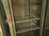 a glass door that is open to show the inside of a refrigerator