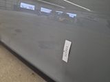 a sticker on the door of a car that is parked in a garage
