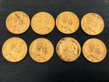six souverains d'or, dont l'un porte le portrait d'un homme