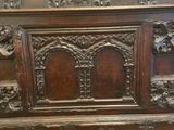 an old wooden chest sitting on top of a hard wood floor