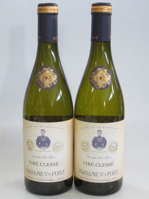 two bottles of white wine sitting next to each other on a table