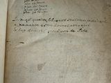 an old book with writing on it sitting on top of a table