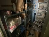 a room with a lot of stuff on the shelves