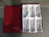 boxed wine glasses in a red box on a table