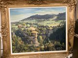 une photo d'un tableau représentant un paysage dans un cadre doré