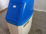 a blue and white trash can sitting on the floor