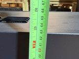 a green ruler that is on a table