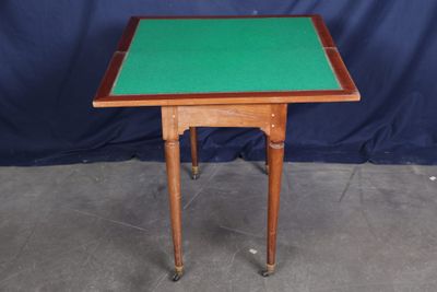 an image of a small table with a green top and legs