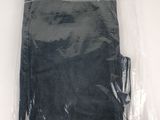 a plastic bag with a pair of black pants inside of it