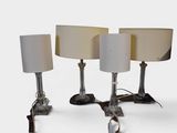 three lamps that are sitting on a table