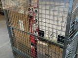 a large metal cage with a bunch of boxes in it