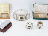 a lot of silver items that are on a table