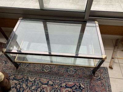 Table basse en inox et verre à plateau d'entrejambe