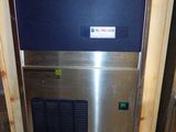an image of a stainless steel ice machine in a room