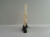 a white candle that is sitting on a table