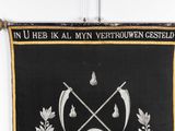 black and gold banner with a skull and crossed swords on it