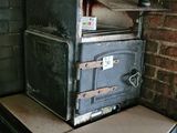 an old oven sitting on top of a counter in a kitchen