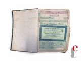 an old book that has a certificate on it