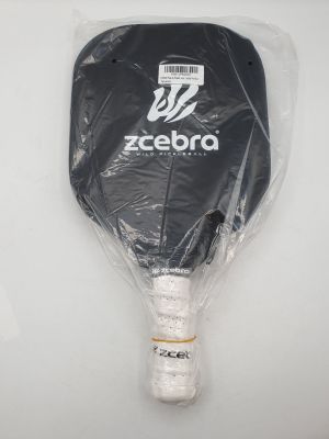 the tennis racket is wrapped in plastic and ready to be used