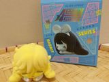 a small toy that is sitting on the floor next to a box