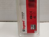 an image of a plastic container with a red label on it