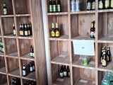 many bottles of beer on the shelves in the room