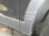 a close up of a car ' s door with a hole in the side