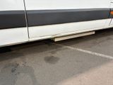 a white van that is parked in a parking lot